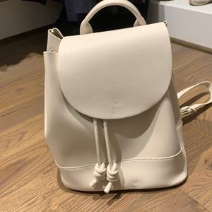 Off-white faux leather backpack